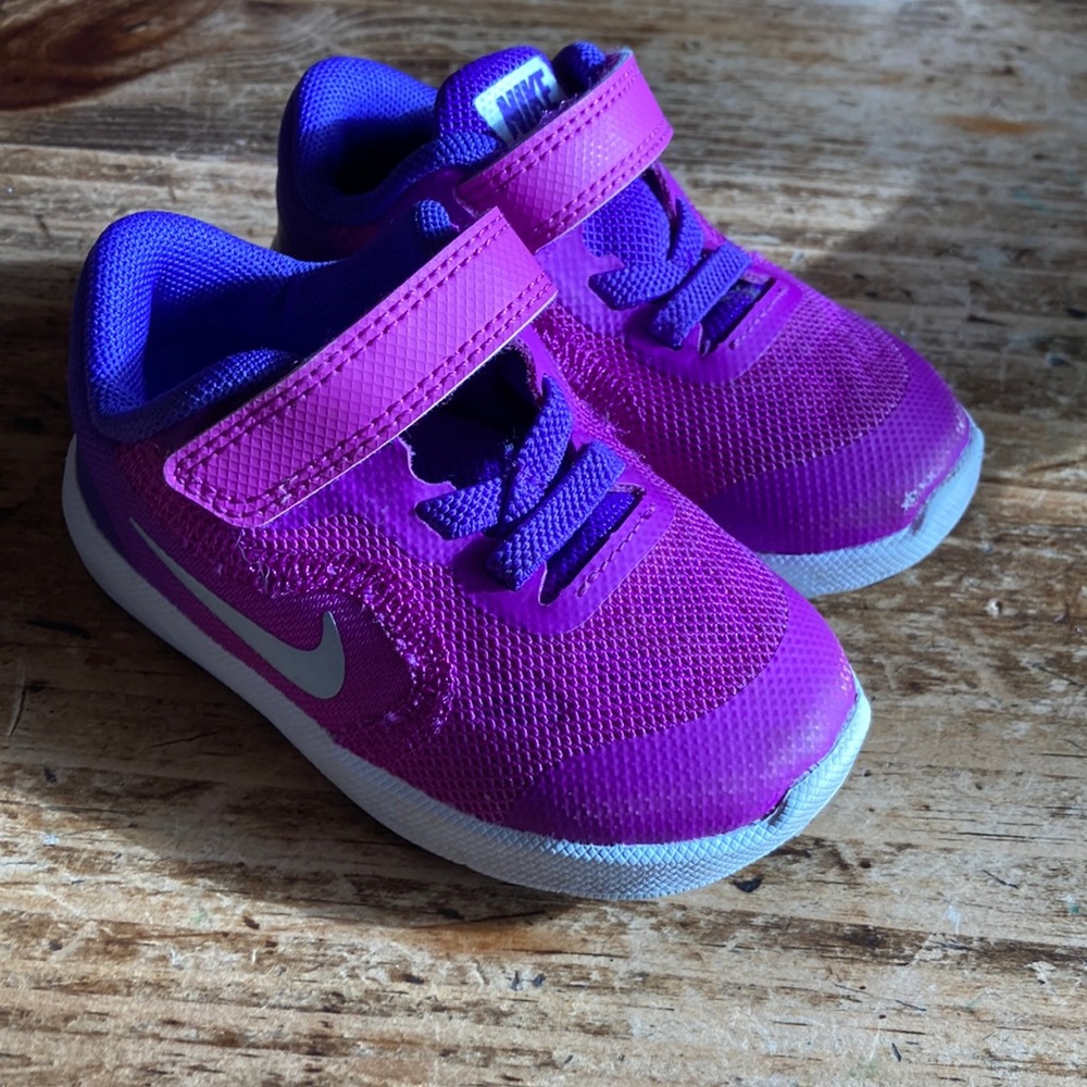 Toddler Nike Shoes. Lightly worn. Magenta and purple colors.